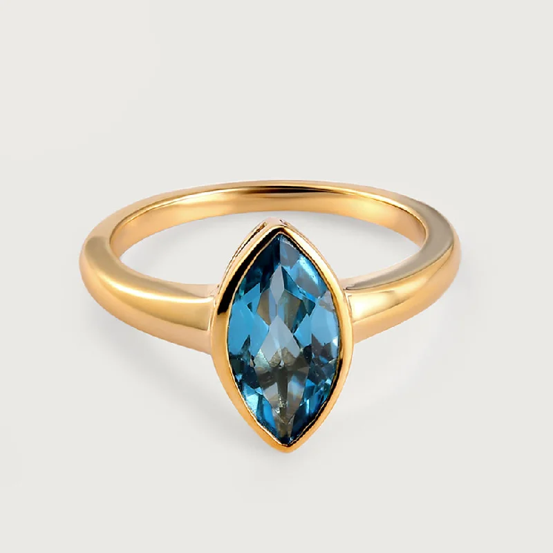 Surf Moon Solitaire Blue Topaz Ring in 9K Gold